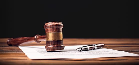 Gavel and Pen on top of a Document