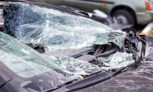 Smashed windshield of a damaged car