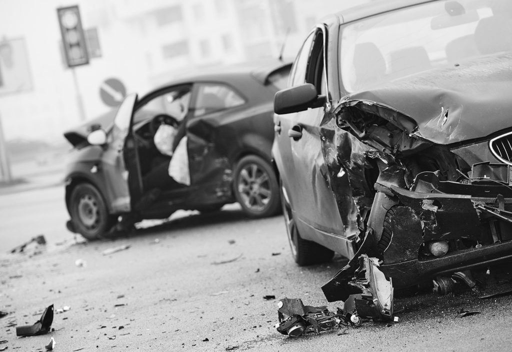 two smashed vehicles after a car crash