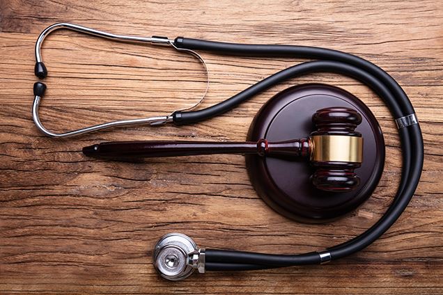 Gavel and Mallet beside a Stethoscope
