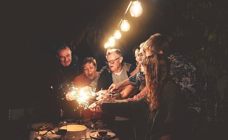 A group of adults enjoying some fireworks