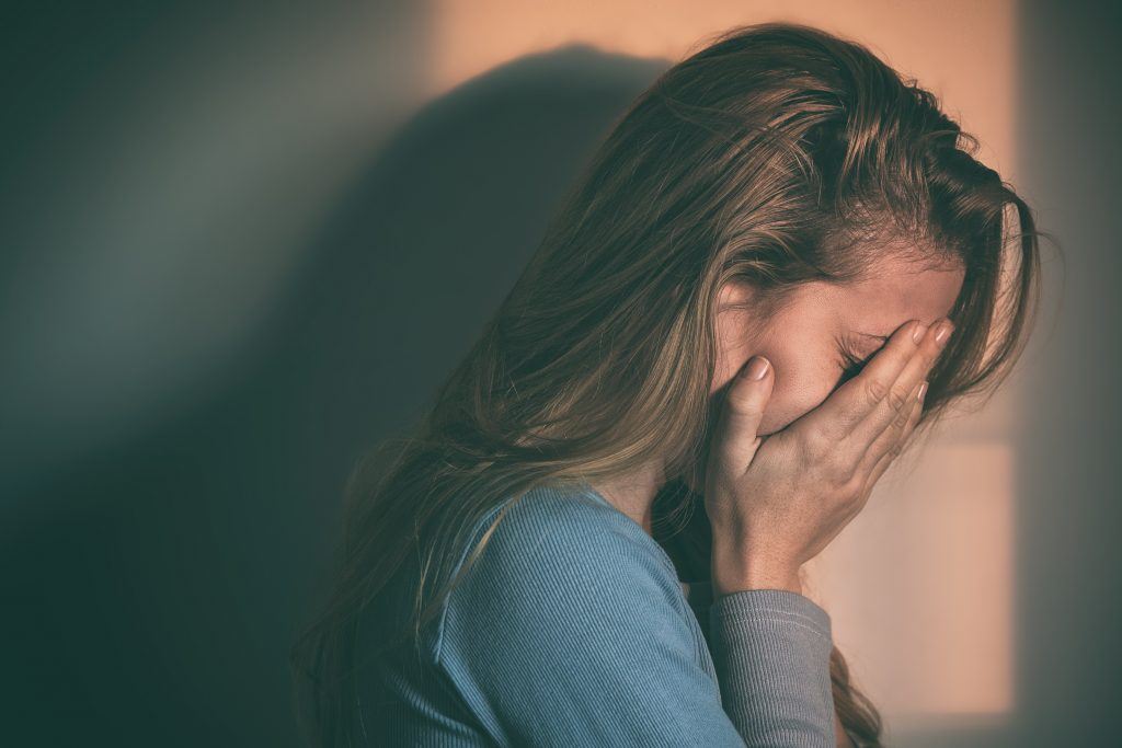 Crying Lady with hands covering her face