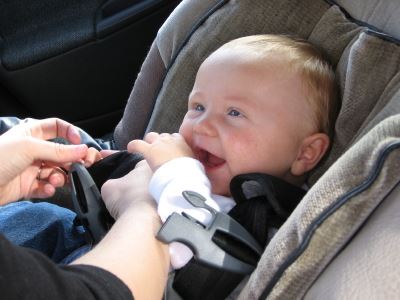 Smiling Baby in a Car Seat