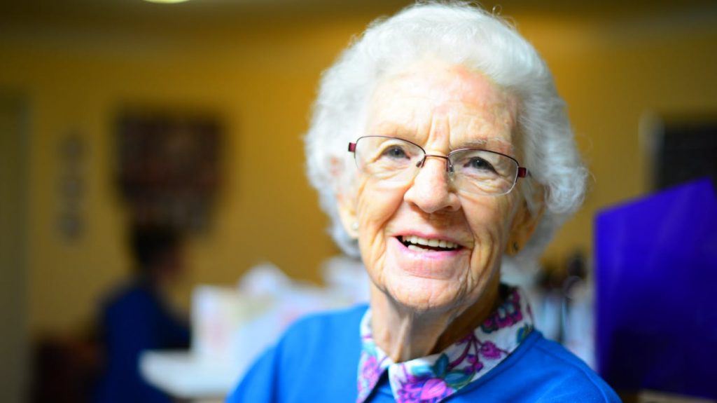 elderly woman smiling at the camera