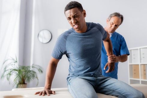 injured man being examined by doctor