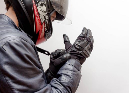motorcyclist putting on safety gear