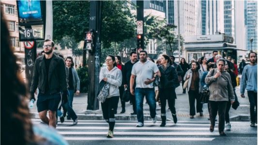 pedestrians crossing the street in a crosswalk