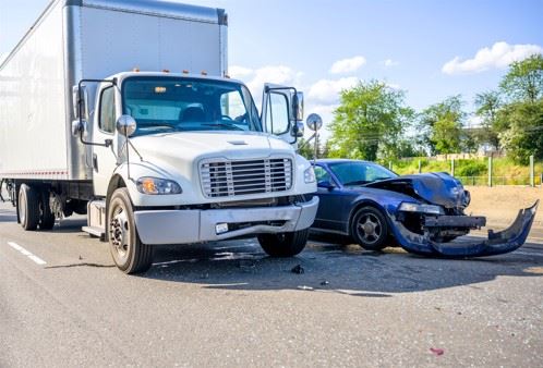 semi truck and passenger car after crash