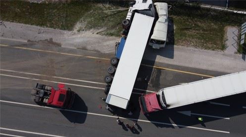 two semi trucks overturned on highway